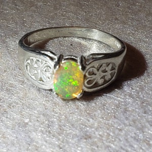 Opal solitaire set in sterling silver band