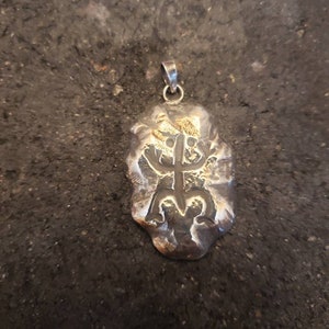Taino coqui in silver