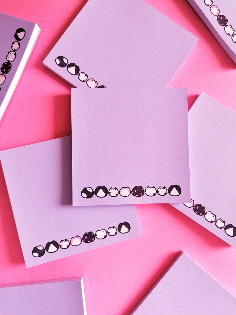 a few of the notepads on pink background