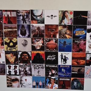 May include: A collage of album covers from bands like Pearl Jam, System of a Down, and Green Day. The square album art displays a variety of images, from band portraits to abstract designs, arranged on a white surface.