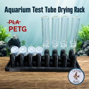 May include: A black rectangular drying rack with eight vertical pegs, four clear glass test tubes, and four translucent plastic caps. The text "Aquarium Test Tube Drying Rack" and "PLA PETG" with a strikethrough on PLA are visible in the image.