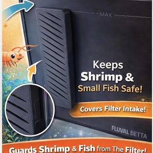 May include: Black aquarium filter guard with angled slots, designed to protect shrimp and small fish. The text reads "Keeps Shrimp & Small Fish Safe!" and "Covers Filter Intake!" The product is labeled "FLUVAL BETTA."
