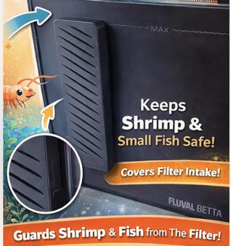 May include: Black aquarium filter guard with angled slots, designed to protect shrimp and small fish. The text reads "Keeps Shrimp & Small Fish Safe!" and "Covers Filter Intake!" The product is labeled "FLUVAL BETTA."