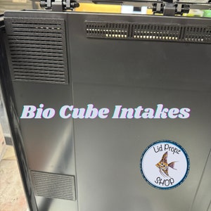 May include: Black plastic lid with three rectangular air vents. The lid has the text "Bio Cube Intakes" and a logo that says "Lid Propz Shop" with a yellow and orange fish.