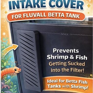 May include: Black intake cover for a Fluval Betta tank. The cover has a slotted design and text that reads "Prevents Shrimp & Fish Getting Sucked Into the Filter!" An orange arrow points to the cover, and a cartoon shrimp is visible.