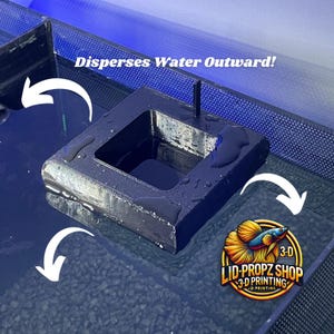 May include: A black 3D printed water diffuser for aquariums. The diffuser is square shaped with a square opening in the centre. The diffuser is submerged in water and the water is dispersing outwards from the opening. The text "Disperses Water Outward!" is written above the diffuser. The text "3-D LID-PROPZ SHOP 3-D PRINTING" is written below the diffuser.