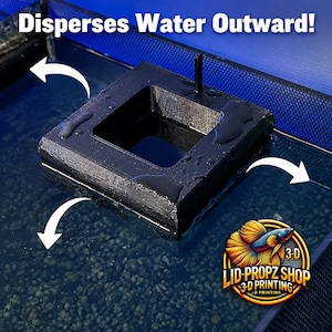 May include: A black square 3D printed water flow deflector floating on the surface of an aquarium. The device features a central opening and white arrows indicating water movement. Text at the top reads Disperses Water Outward! with a logo.