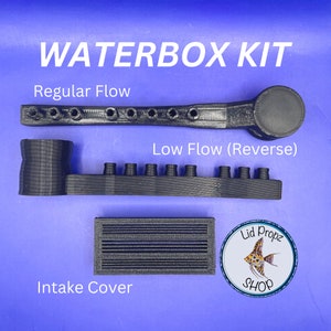 May include: A black plastic waterbox kit with two different flow options: regular and low flow (reverse). The kit also includes a black plastic intake cover. The kit is labeled "Waterbox Kit" and "Lid Propz Shop".