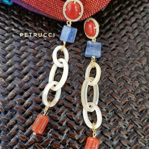 horn and stone earrings, red and light blue earrings, pendant and light earrings, coral paste and kyanite earrings, stone earrings