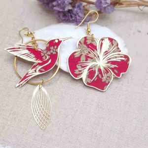 mismatched asymmetrical earrings: large hummingbird and large hibiscus in Liberty Capel ruby FABRIC and gold stainless steel