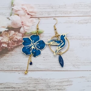 Asymmetrical mismatched hummingbird and cherry blossom earrings in blue Maya liberty fabric and gold-plated stainless steel