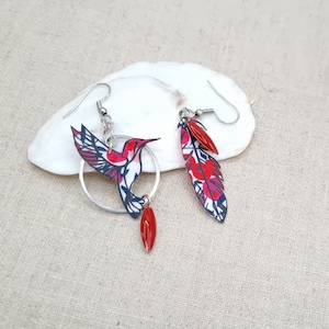 Asymmetrical mismatched hummingbird and feather earrings in red liberty wiltshire fabric and silver stainless steel