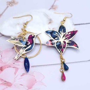 Mismatched asymmetrical hummingbird bird and fleur-de-lis earrings in liberty Perséphone purple fabric and gold steel