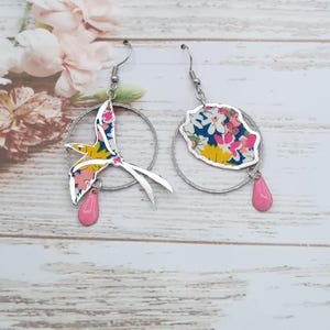 Asymmetrical mismatched earrings with a Paille en Queue bird and Reunion Island in tangerine Liberty Libby fabric and steel