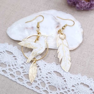Mismatched asymmetrical hummingbird and feather earrings in IANTHE liberty fabric and gold stainless steel
