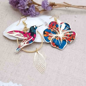 mismatched asymmetrical large hummingbird and large hibiscus earrings in oil Ciara liberty FABRIC and golden stainless steel