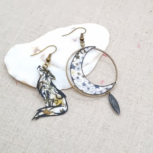 Mismatched asymmetrical moon and wolf earrings in bronze brass and Adelajda brown liberty fabric