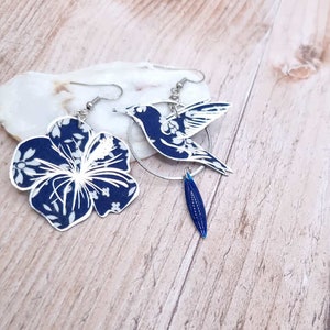 mismatched asymmetrical earrings: large hummingbird and large hibiscus in liberty capel navy FABRIC and silver stainless steel