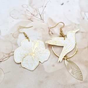 mismatched asymmetrical earrings: large hummingbird and large hibiscus in Ianthe liberty FABRIC and gold stainless steel