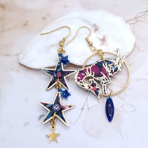 Mismatched asymmetrical earrings sign Capricorn and stars in Liberty Persephone purple fabric and gold stainless steel