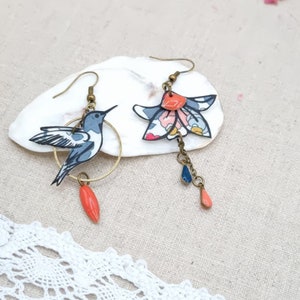 Asymmetrical mismatched hummingbird bird and fleur-de-lys earrings in liberty betsy porcelain and bronze brass fabric