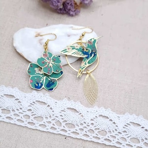 mismatched asymmetrical earrings large hummingbird and sakura cherry blossom in liberty donna leigh jade fabric and stainless steel