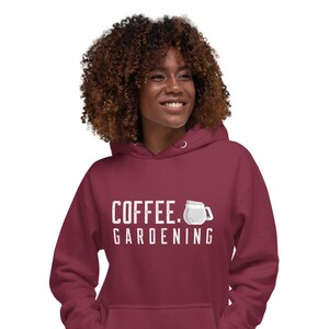 May include: A maroon hoodie with a white graphic that says "COFFEE. GARDENING" and a white illustration of a coffee pot.