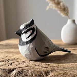 Hand-painted basswood Bridled Titmouse figurine on a black walnut base. Wooden bird sculpture perfect for home decor and bird watcher gifts.