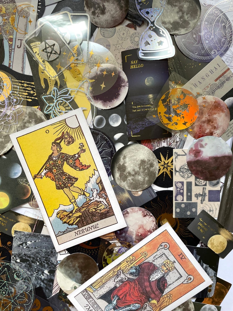 May include: A collection of celestial-themed stickers and tarot cards. The image features various moon phases, stars, and astrological symbols. Several tarot cards are visible, including one with the word "NEBUNUL". The color palette includes gold, black, and shades of purple.