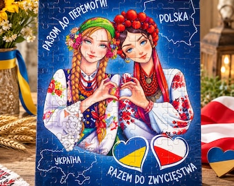 May include: A rectangular jigsaw puzzle featuring an illustration of two individuals in traditional folk attire forming a heart shape with their hands. The puzzle includes the text RAZOM DO PEREMOGY, POLSKA, UKRAINA, and RAZEM DO ZWYCIESTWA.