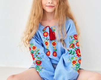 Beautiful children's blue blouse-vyshyvanka from Ukraine with bright floral embroidery There are sizes for girls 4-12 years old