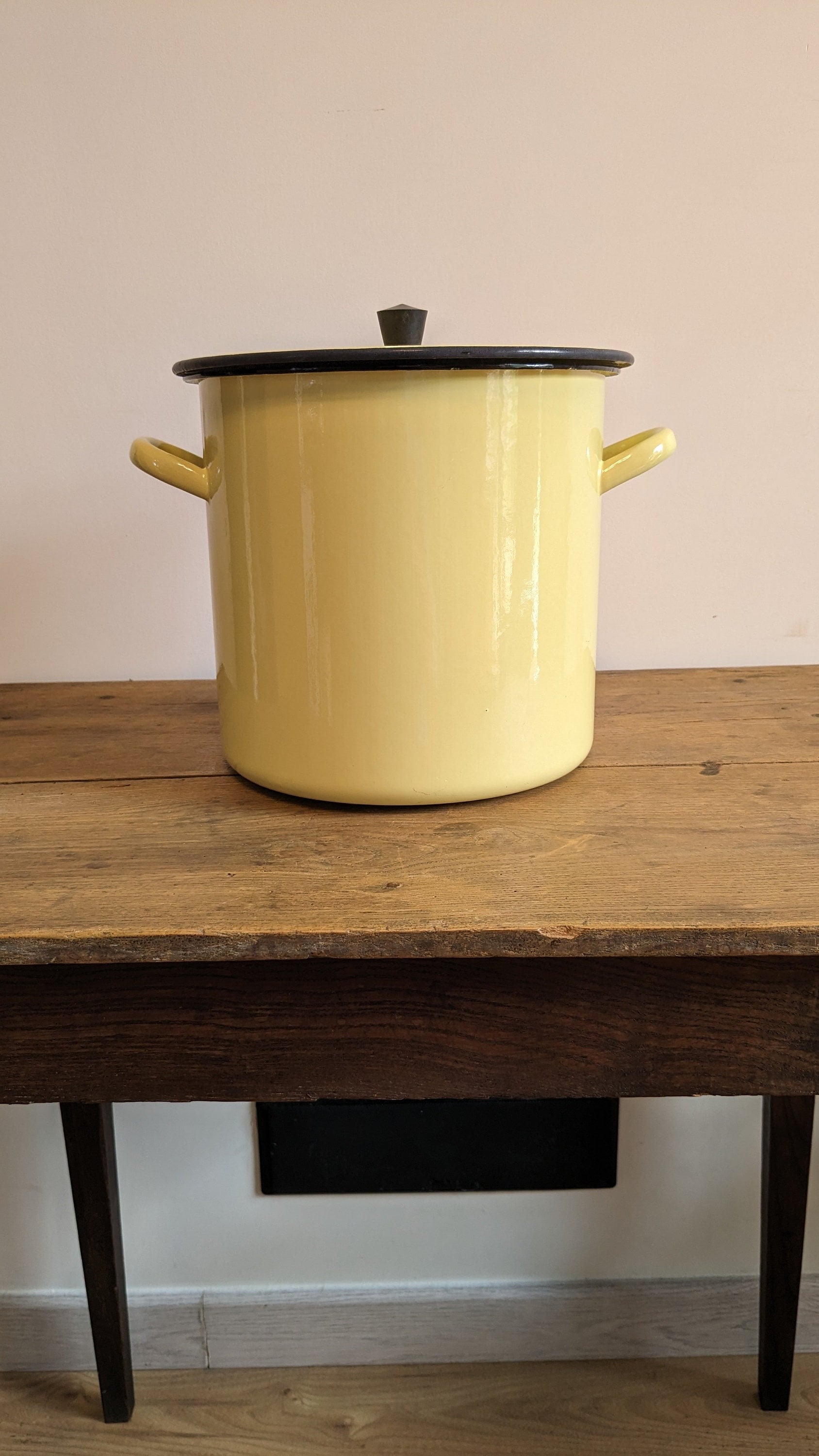 Old yellow enameled pot