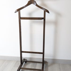 Vintage dark wood valet stand on wheels – Elegant antique suit rack – Retro bedroom dressing room decor