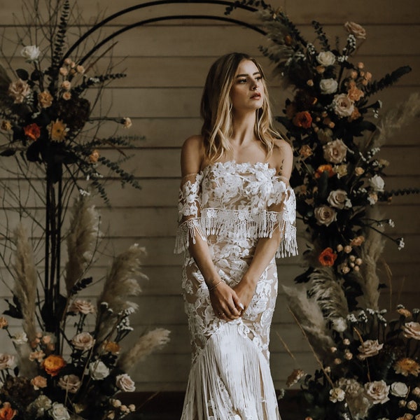 Off Shoulder Nude and Ivory Floral Lace Boho Wedding Dress With Tassels