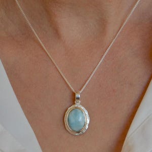 Larimar pendant, silver, matte, light blue oval gemstone