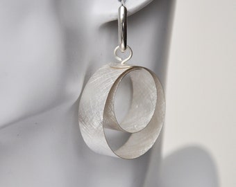 Creole silver stripes, two silver hoops in an ice-matt look hanging in each other, extravagant design, statement earrings