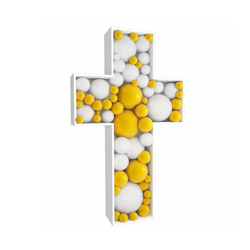 May include: A white cross-shaped wall decoration filled with yellow and white spheres of varying sizes. The spheres are arranged to fill the cross's interior, creating a textured, three-dimensional effect. The cross has a clean, modern design.