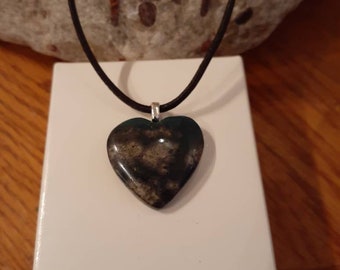 Unique and beautiful Heart Shaped Leeland Blue pendant Leeland Michigan Slag glass. With silver plated bail and leather cord.