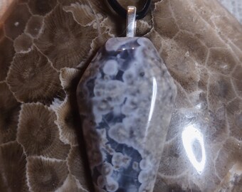 Unique and Interesting Coffin Shaped Leeland Blue pendant; Leeland Michigan Slag glass. With silver plated bail and leather cord.