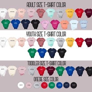 May include: A color chart displaying various t-shirt options categorized by size: Adult, Youth, Toddler, and Onesie. Each section features rows of short-sleeved shirts in colors including white, natural, peach, pink, mauve, mint, heather, mustard, red, maroon, green, blue, navy, black, lilac, berry, sunset, and ice blue.