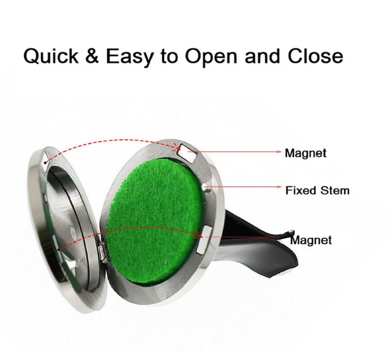 May include: A silver car air freshener with a magnetic lid that opens to reveal a green scented pad. The air freshener has a fixed stem and a magnet on the back for attaching to a vent.