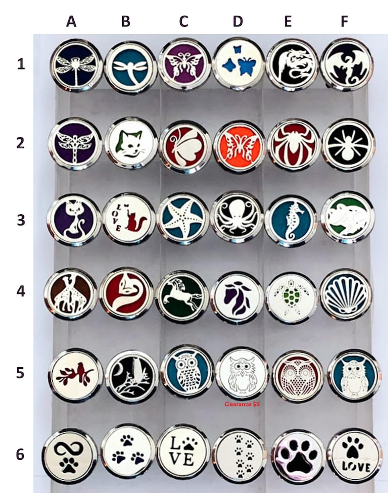 May include: A set of 36 silver car air freshener medallions with various designs, including butterflies, cats, owls, starfish, and paw prints. The medallions are arranged in a grid of six rows and six columns.