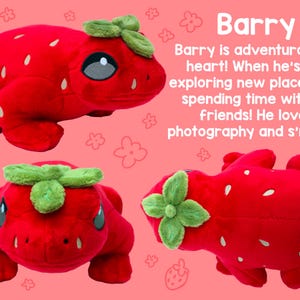 May include: A plush strawberry frog toy with a green leaf on its head. The frog is red with white seeds and has a friendly expression.