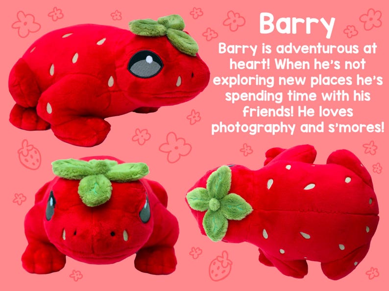 May include: A plush strawberry frog toy with a green leaf on its head. The frog is red with white seeds and has a friendly expression.