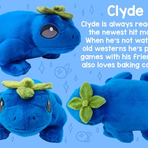 May include: A blue plush toy frog with a green leaf on its head. The frog is in three different poses, showing its front, side, and back. The frog is a handmade plush toy.