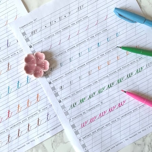 May include: Two pages of a calligraphy workbook with instructions for practicing the letters 't' and 'w' in Copperplate script. The pages are filled with lines for practicing the letters, and there are examples of how to write the letters in different colors. The workbook also includes instructions on how to adjust the letters to celebrate progress.
