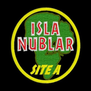 May include: A yellow circle with a green outline, containing a green island shape with the text "ISLA NUBLAR SITE A" in white and red lettering.