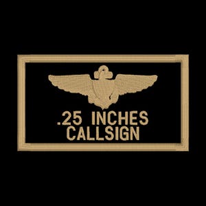 May include: A tan embroidered patch with a gold anchor and wings. The text on the patch reads ".25 inches callsign".