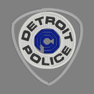 Puede incluir: Un parche bordado blanco y negro con el texto "DETROIT POLICE" en un círculo alrededor de una letra "C" estilizada azul y blanca.
