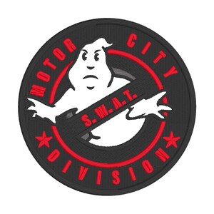 May include: Embroidered patch featuring a white ghost-like figure with a stern expression, set against a black background. The design includes red text that reads "MOTOR CITY DIVISION S.W.A.T." and red star accents. The patch is circular.